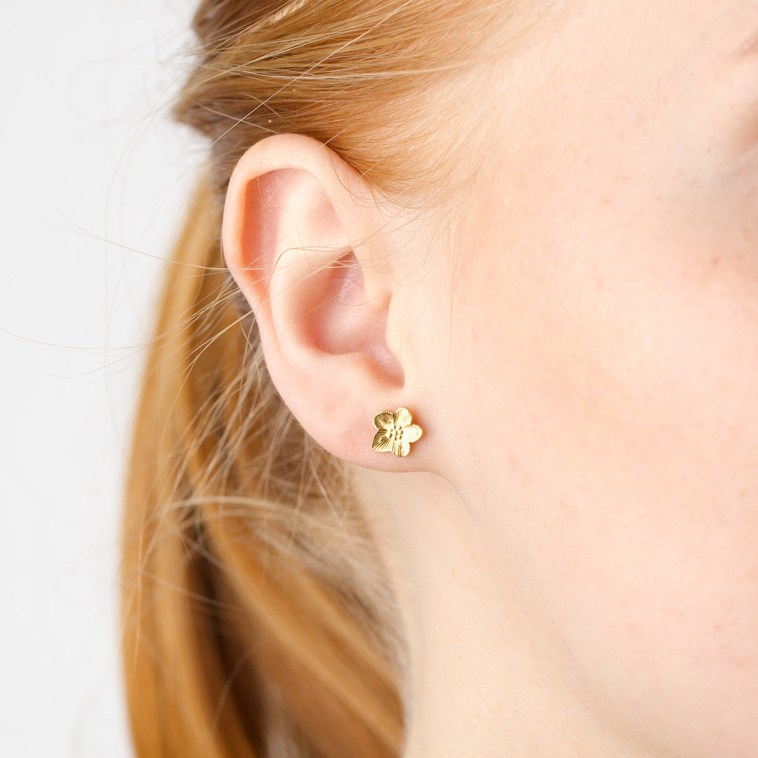 Sadia - Orecchini a bottone a fiore in acciaio inox